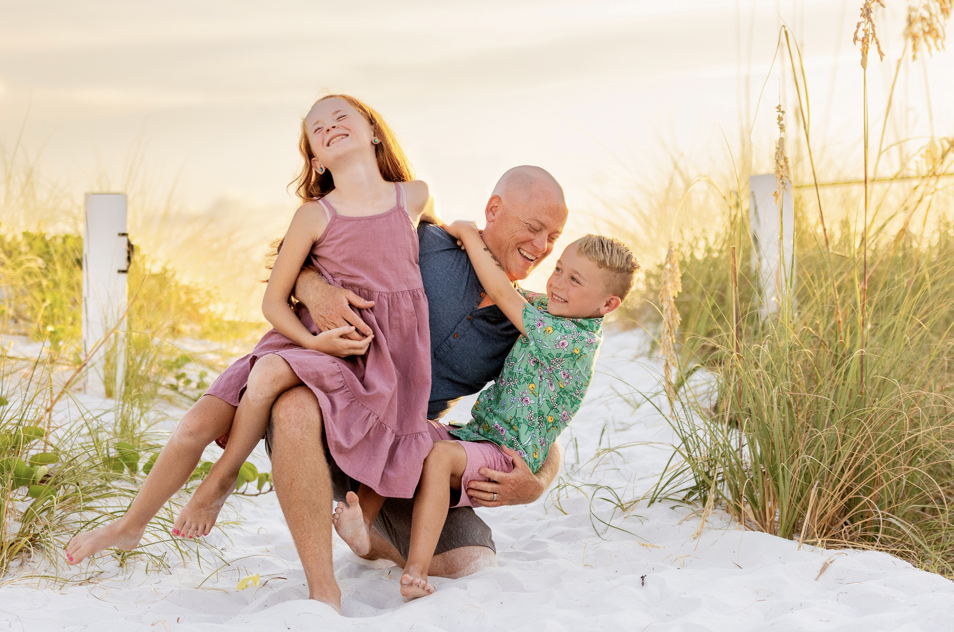 Dad and children laughing on siesta beach